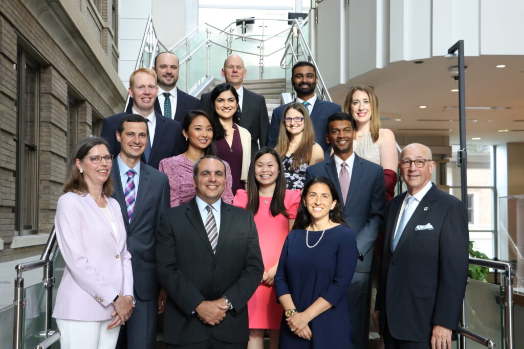 Group photo of graduating residents Jared McAllister, Rahul Handa, Darren Cullinan, Roheena Panni, Tara Semenkovich, Kelly Koch, Linda Schulte, Wen Hui Tan, and Gayan De Silva, with program leaders Paul Wise, Jeffrey Blatnik, Mary Klingensmith, Michael Awad, Jessica Kramer, and Chair Timothy Eberlein.