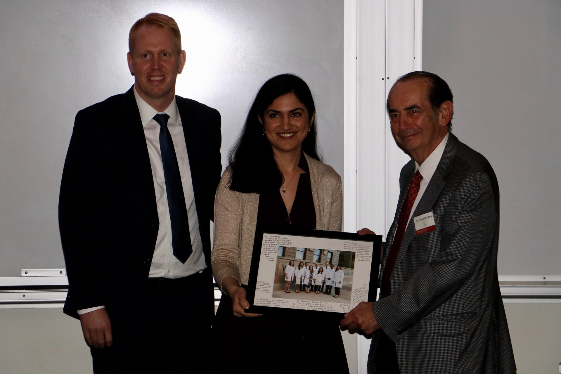 Administrative chief residents Darren Cullinan and Roheena Panni recognize Dr. Steven Strasberg