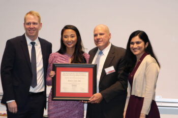 Steven Hunt receives the Moley Mentorship Award from graduating general surgery residents