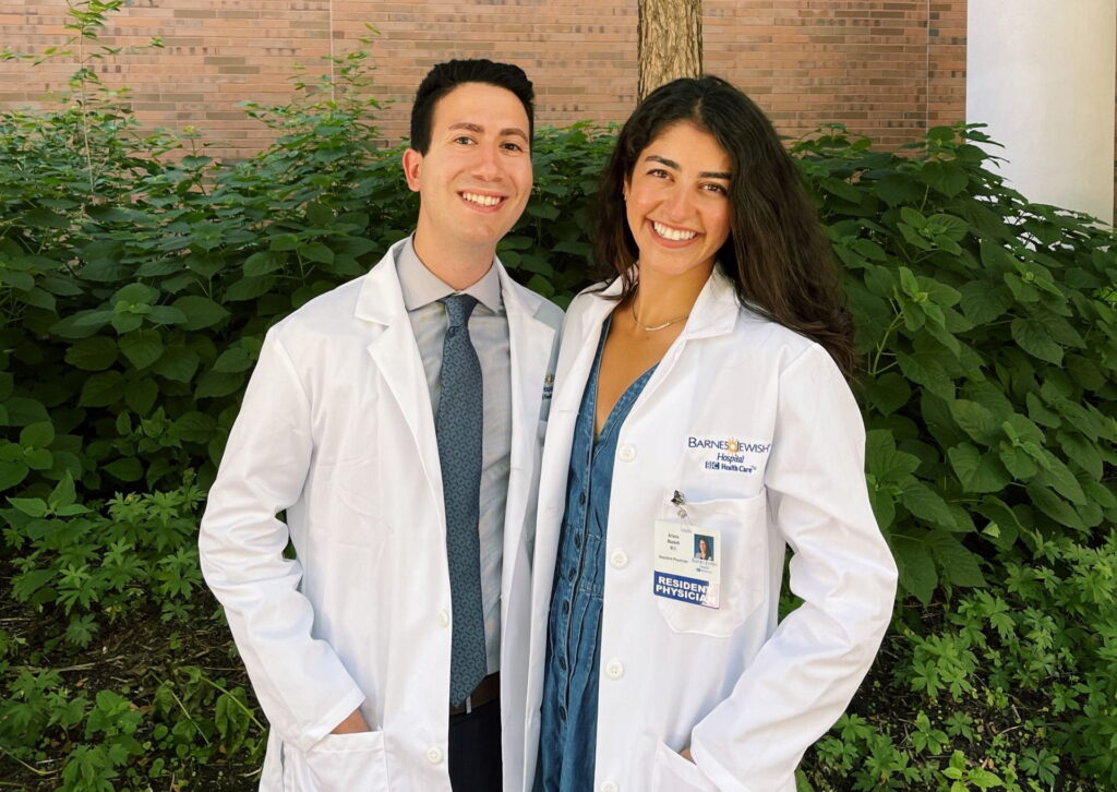 Dr. Tohmasi and Dr. Naaseh in their clinical lab coats at WashU