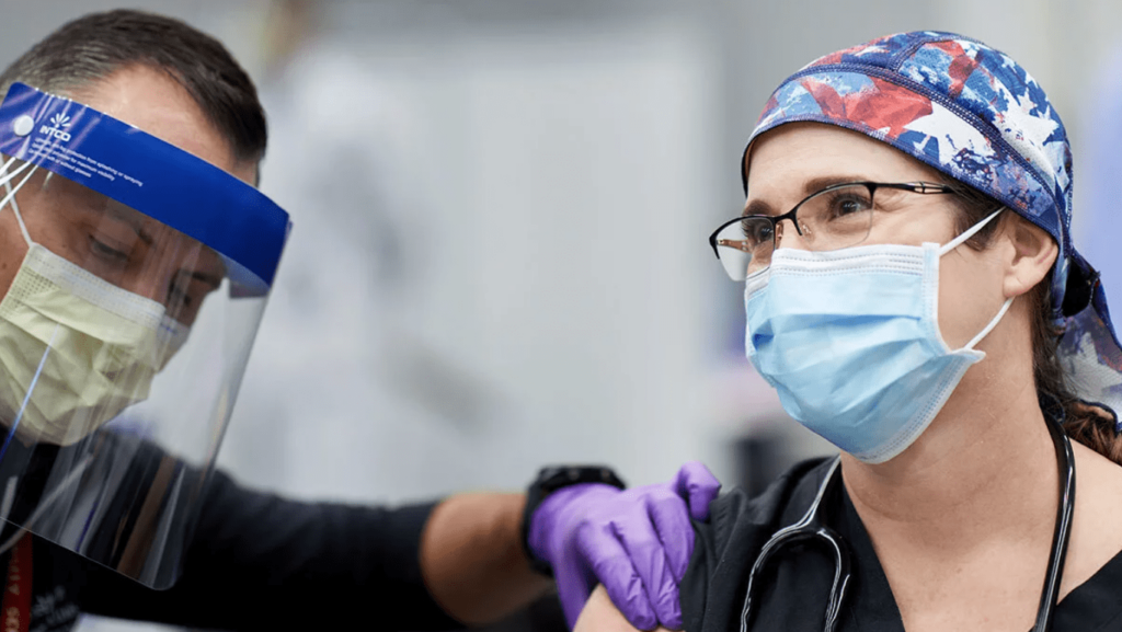 Tiffany Surgeon Tiffany Osborn receiving vaccine