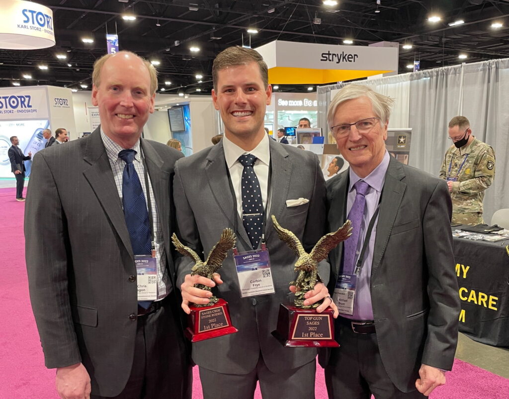 SAGES Top Gun winner Corbin Frye holding trophy with Chris Eagon and Michael Brunt