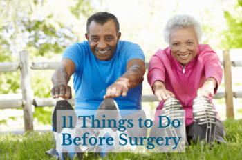 Smiling older adults stretch in a park with trees and fence in background on a sunny day.