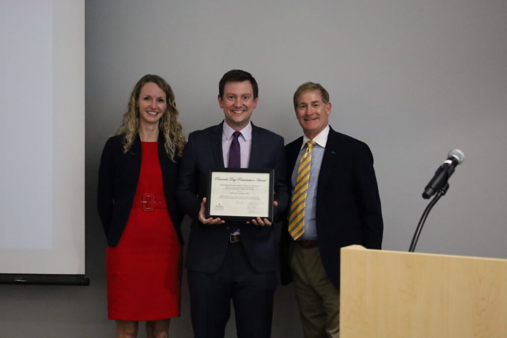 Researcher Andrew Linkugel receives award from surgeons Alison Snyder-Warwick and Steven Buchman