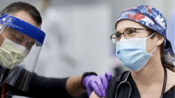 Dr. Tiffany Osborn receiving her COVID-19 vaccination.