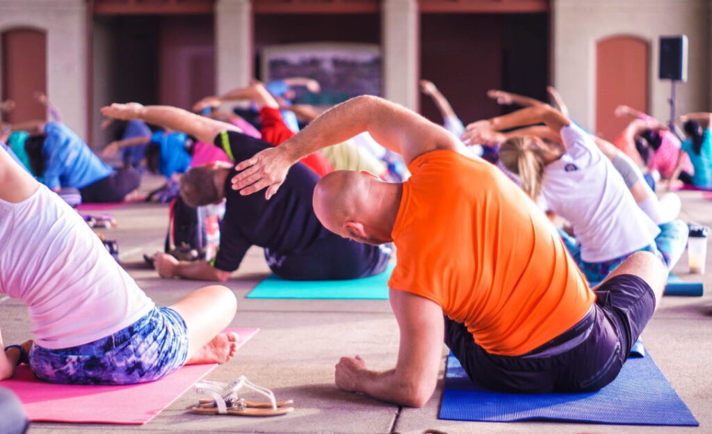 Photo of a group performing stretching exercises.