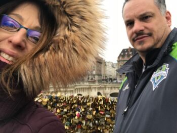 Cancer patient and wife on bridge over river in Paris