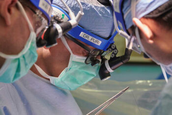 Close up of surgeon Dr. Varun Puri in operating room