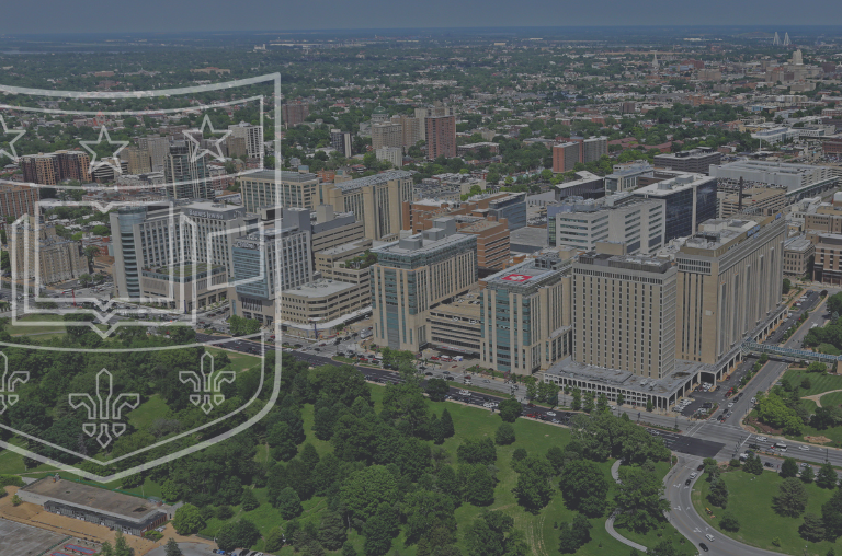 Aerial image of Washington University Medical Center with overlay of shield logo