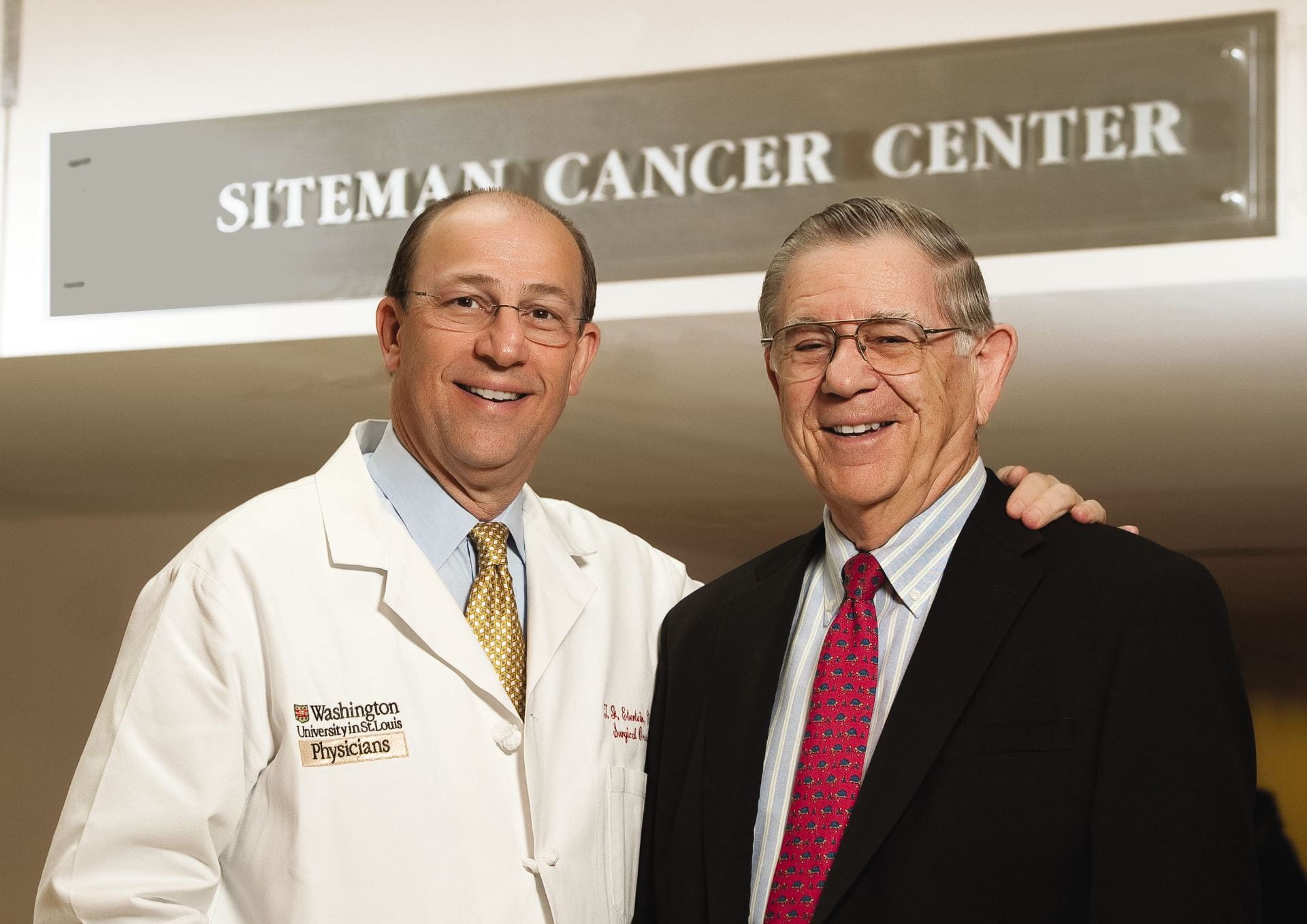 Timothy Eberlein and Alvin Siteman standing in front of the Siteman Cancer Center.