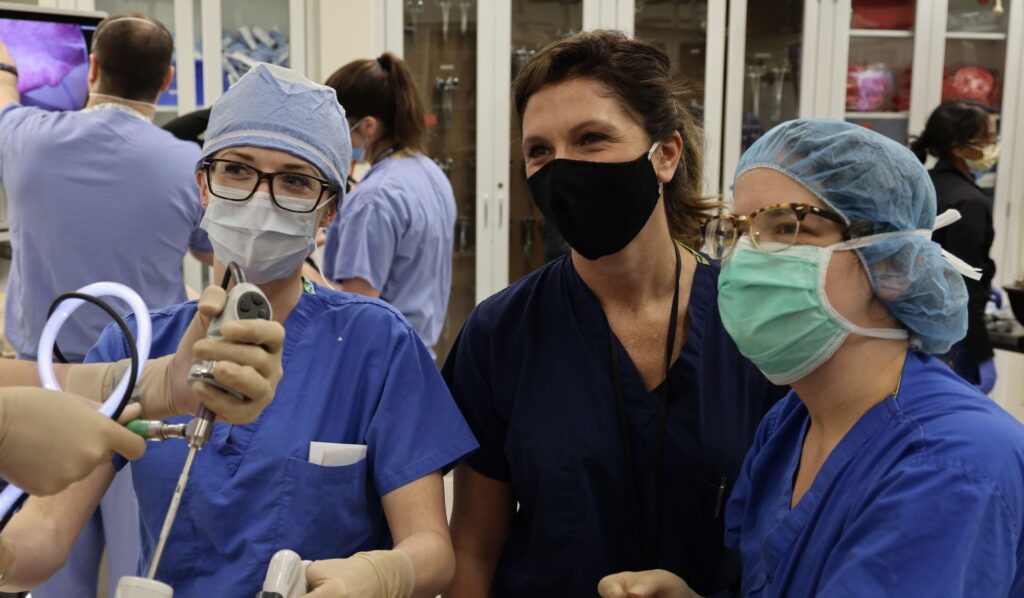 Francesca Dimou, MD, center, in the WISE Center during laparoscopic surgical training