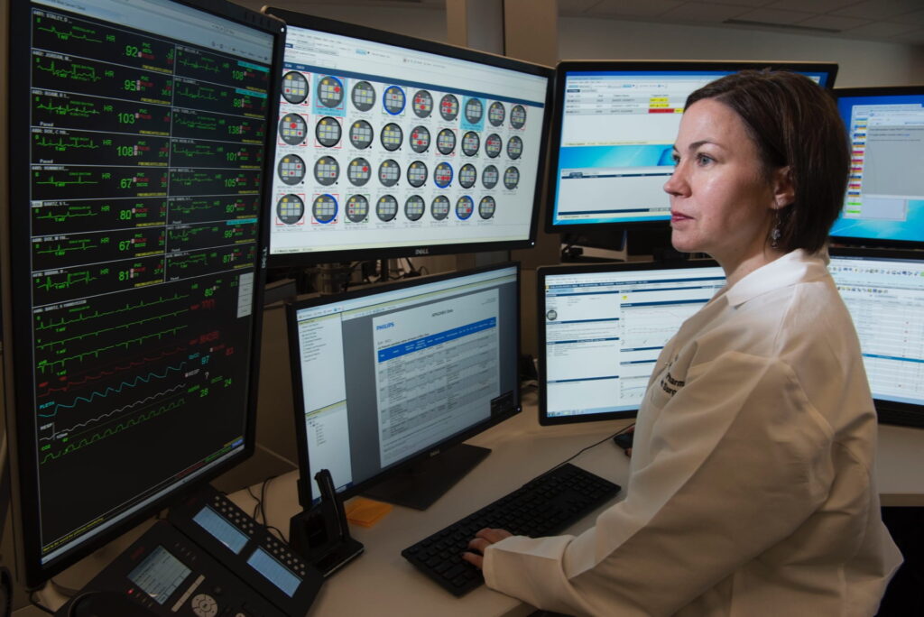 Doctor Sara Buckman at an ICU monitor