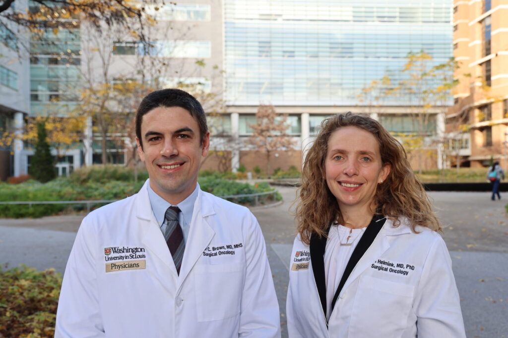 Doctors Brown and Helmink outside at the School of Medicine