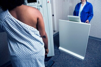 Image of African American woman receiving a mammogram