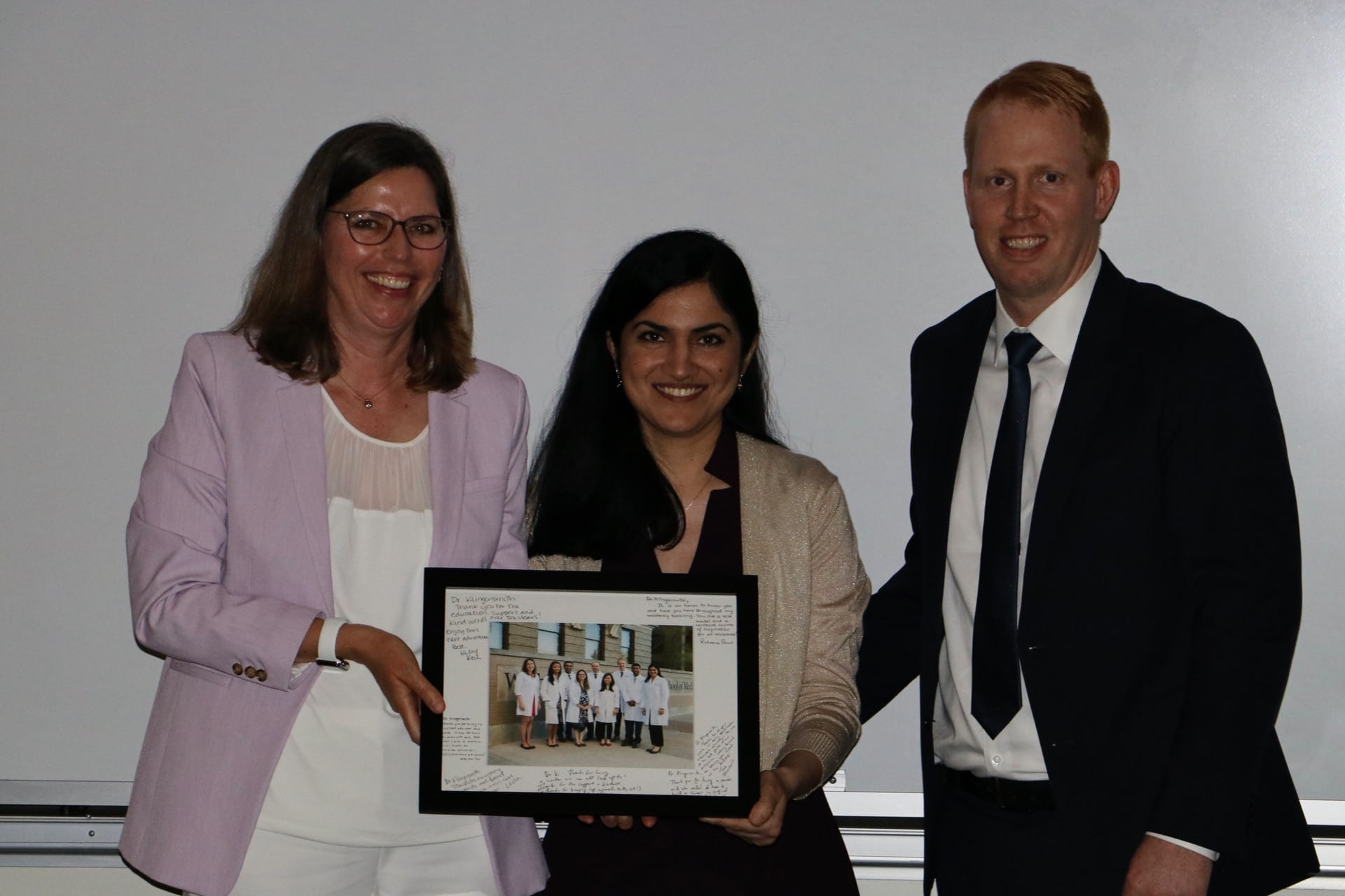 Administrative chief residents Darren Cullinan and Roheena Panni recognize Dr. Mary Klingensmith