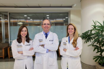 Picture of Doctors Anolik, Sacks and Christensen at the school of medicine