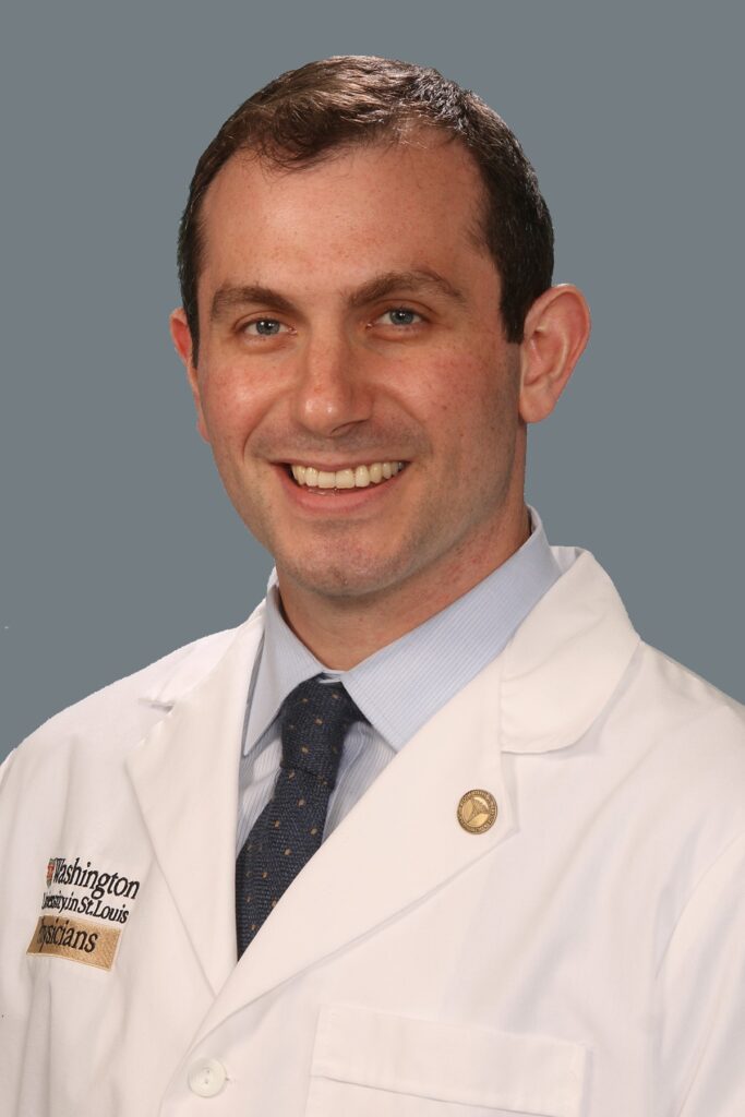 Washington University plastic surgeon Mitchell Pet, MD, in white coat
