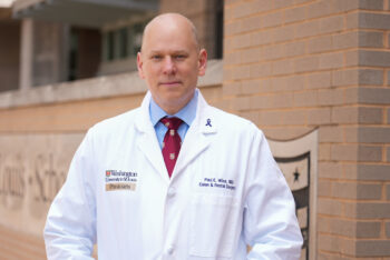 Dr. Paul Wise in white coat outside Washington University School of Medicine in St. Louis