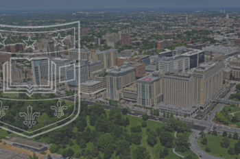 Aerial image of Washington University Medical Center with overlay of shield logo