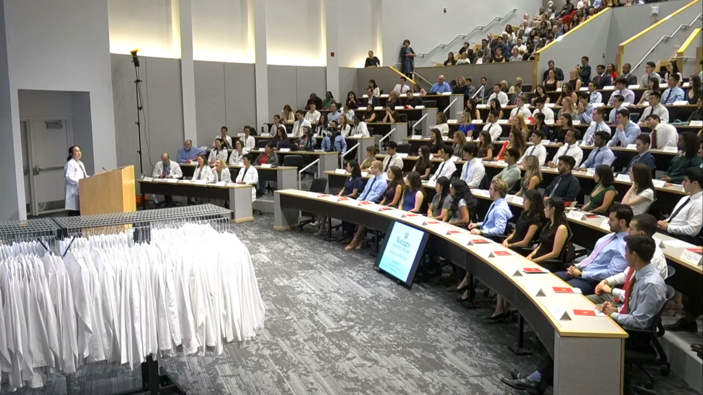 Medical students in an auditorium at a White Coat Ceremony at Washington University